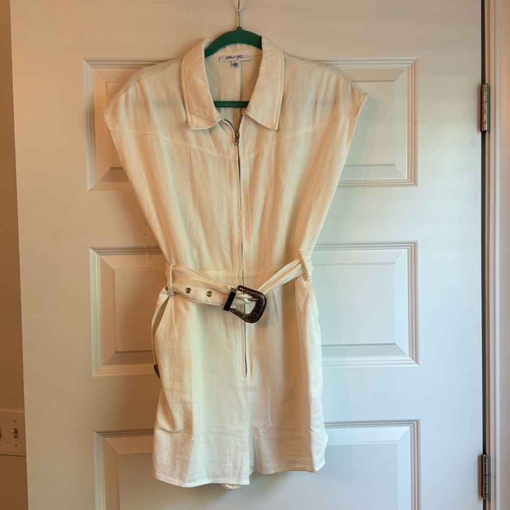 These three boutique white romper